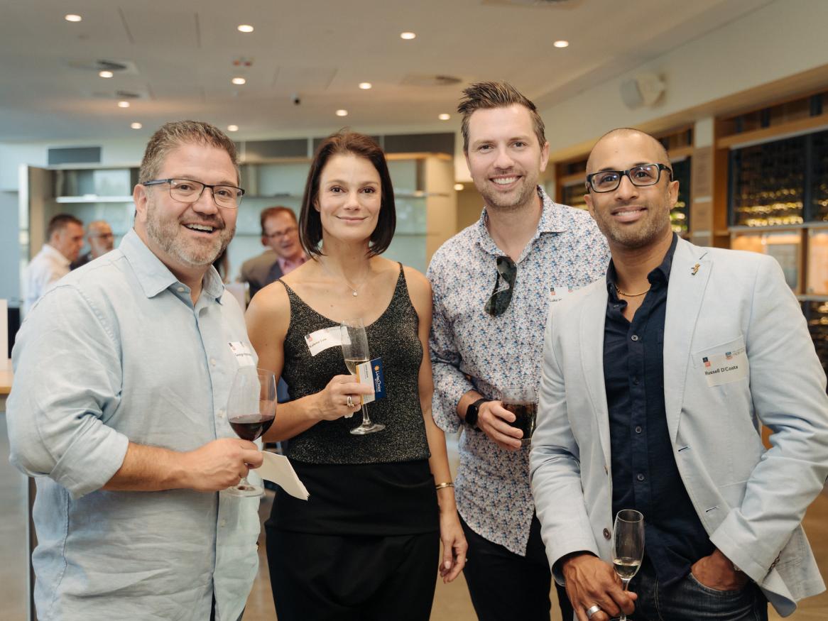 Four MBA alumni at the end of year event