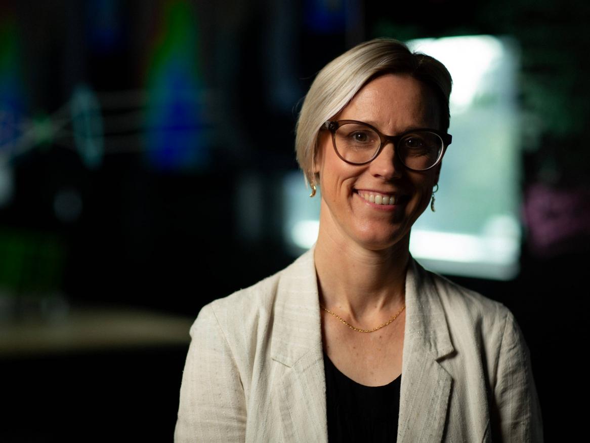 A portrait of Dr Sarah Cannard in the space lab