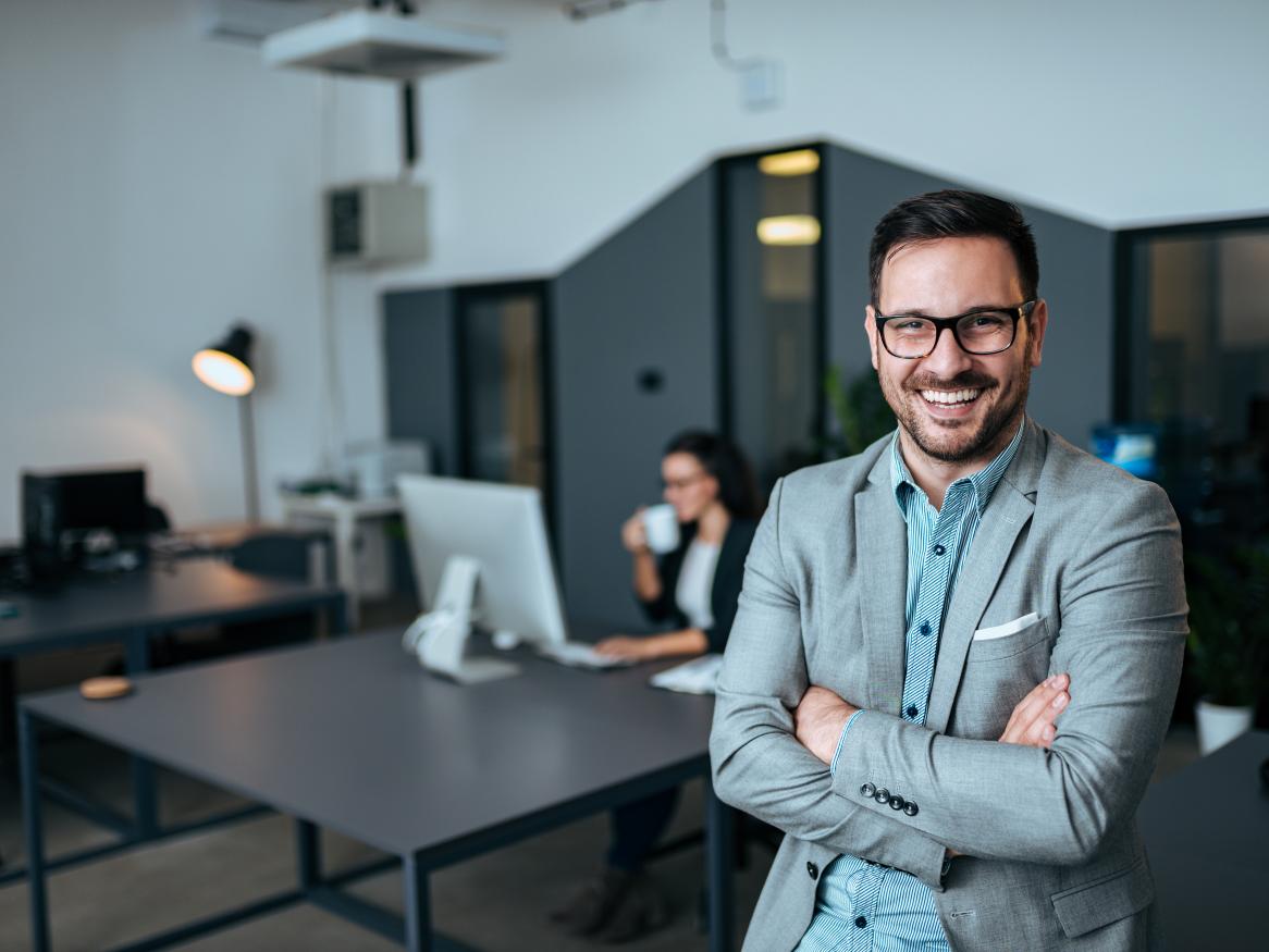 Male smiling with arms crossed