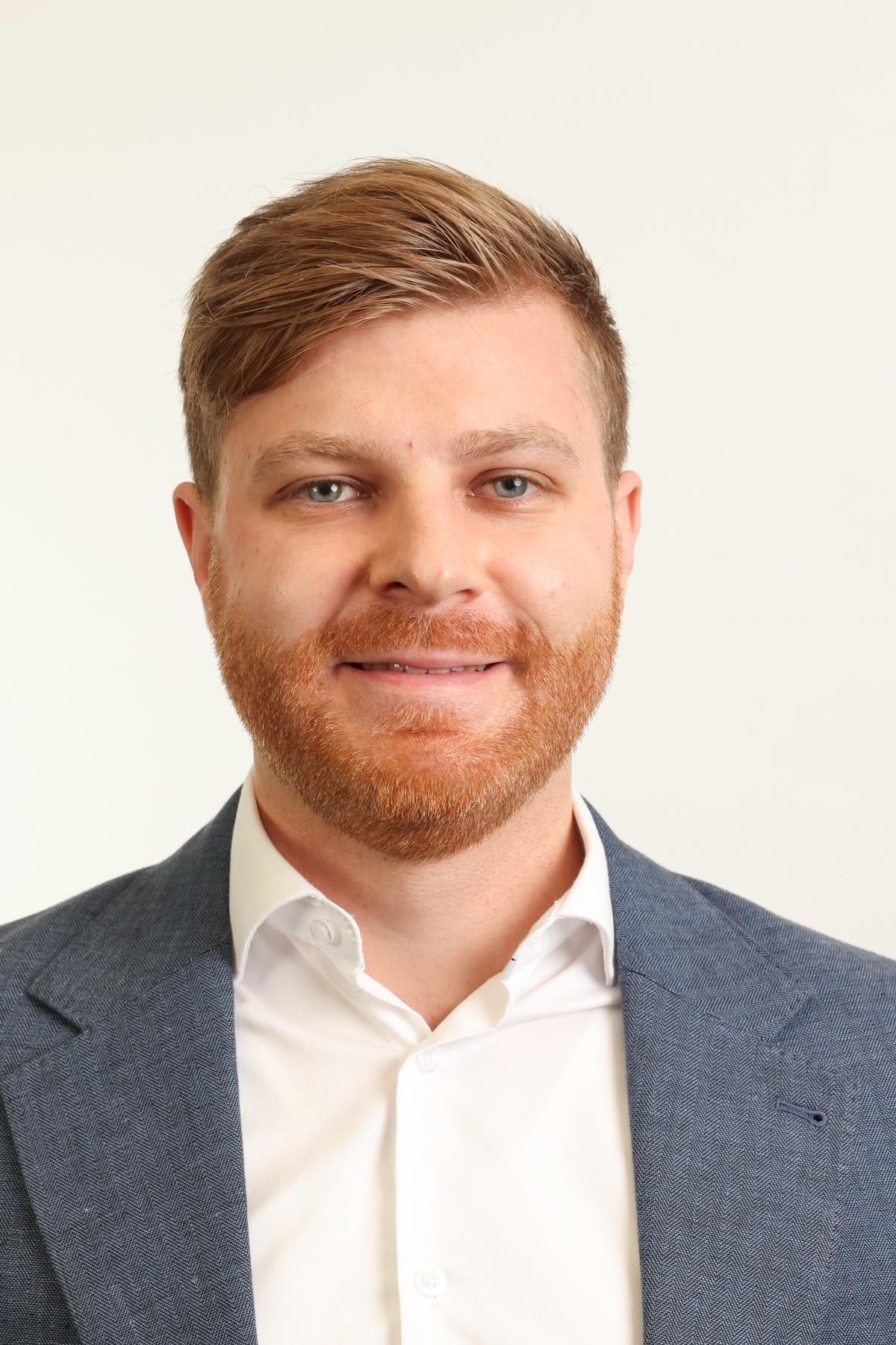 A professional portrait of Julian 